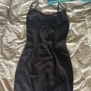 black mini slip dress with lace and floral details